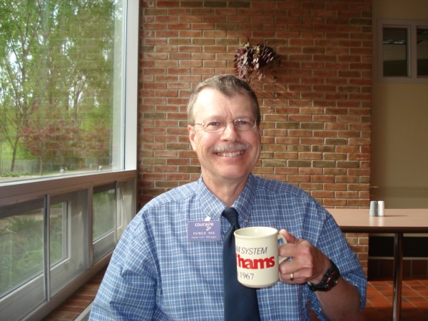 Pat enjoys a cup of coffee from his Handiham mug.