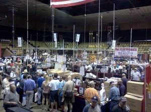 Pictured: A view of the main arena at the HARA facility.  Amateur Radio manufacturers, publishers, and dealers fill this space with some amazing goods and services - anything you might need to set up your station. Look at all the antennas in this photo!  It's a good thing the arena has a really high ceiling.