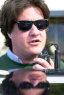 Matt with hand microphone, refected in the shiny roof of Gordon West's car.  Taken at a CA radio camp.